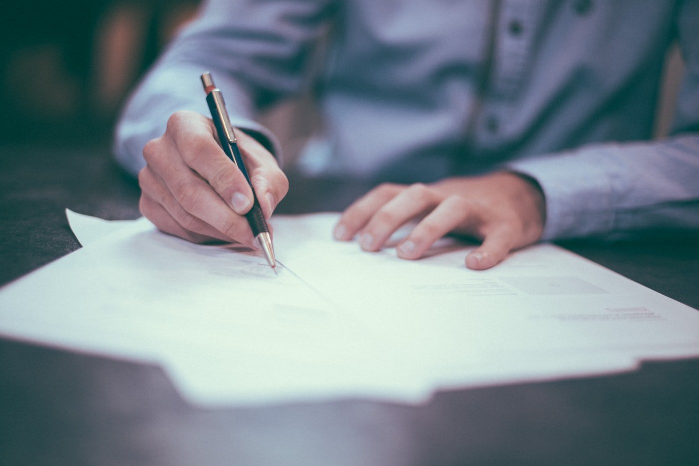 Homeowner reviewing an insurance policy declarations page at a desk